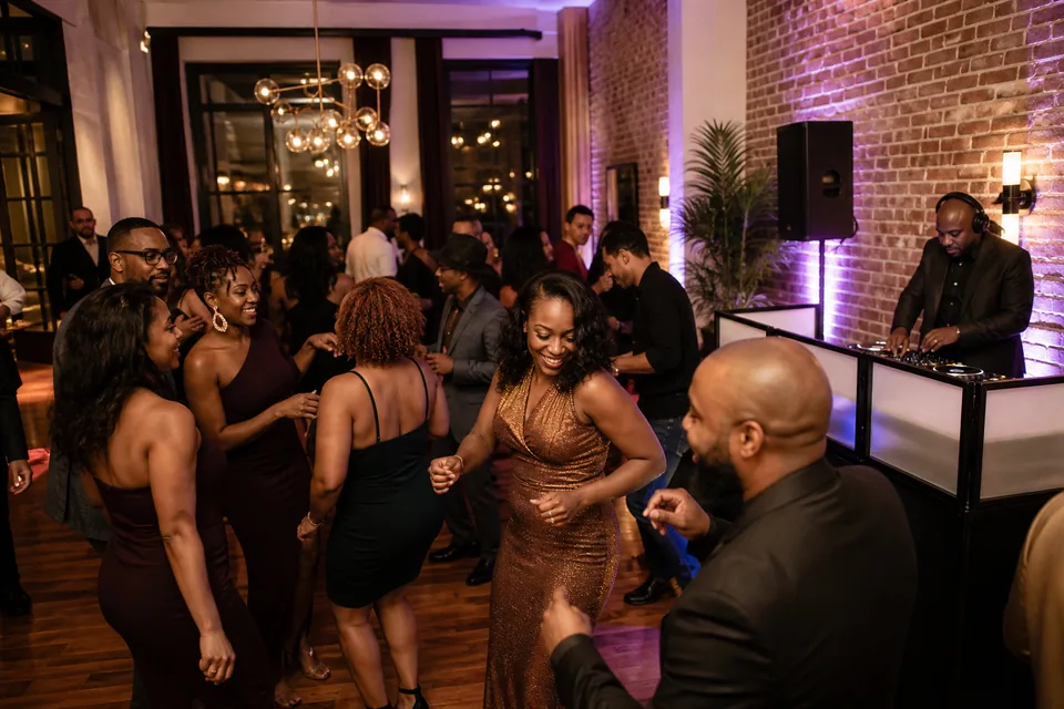 Representative milestone celebration with a DJ and guests dancing