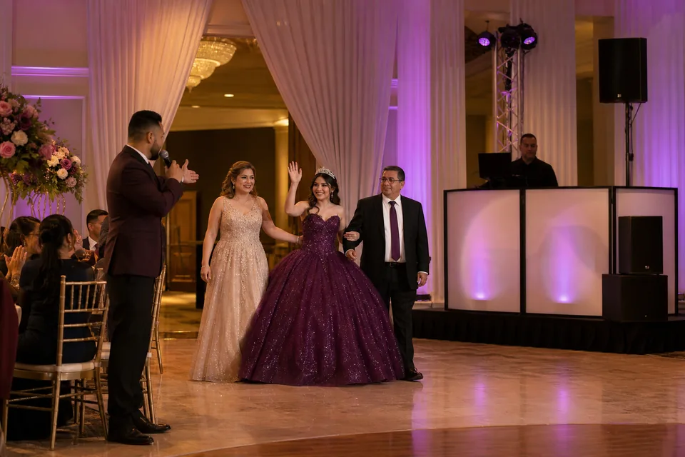 Representative quinceañera formal entrance with family, an MC, and a DJ
